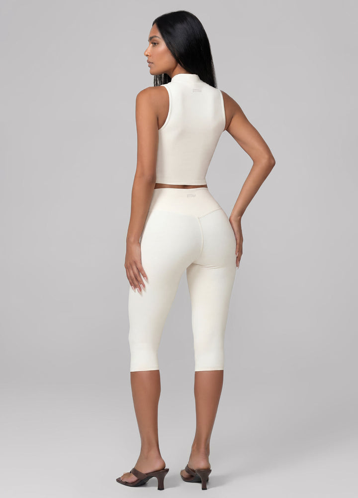 Comfortable women's ivory sculpt capri leggings, perfect for loungewear, yoga, and studio activities.