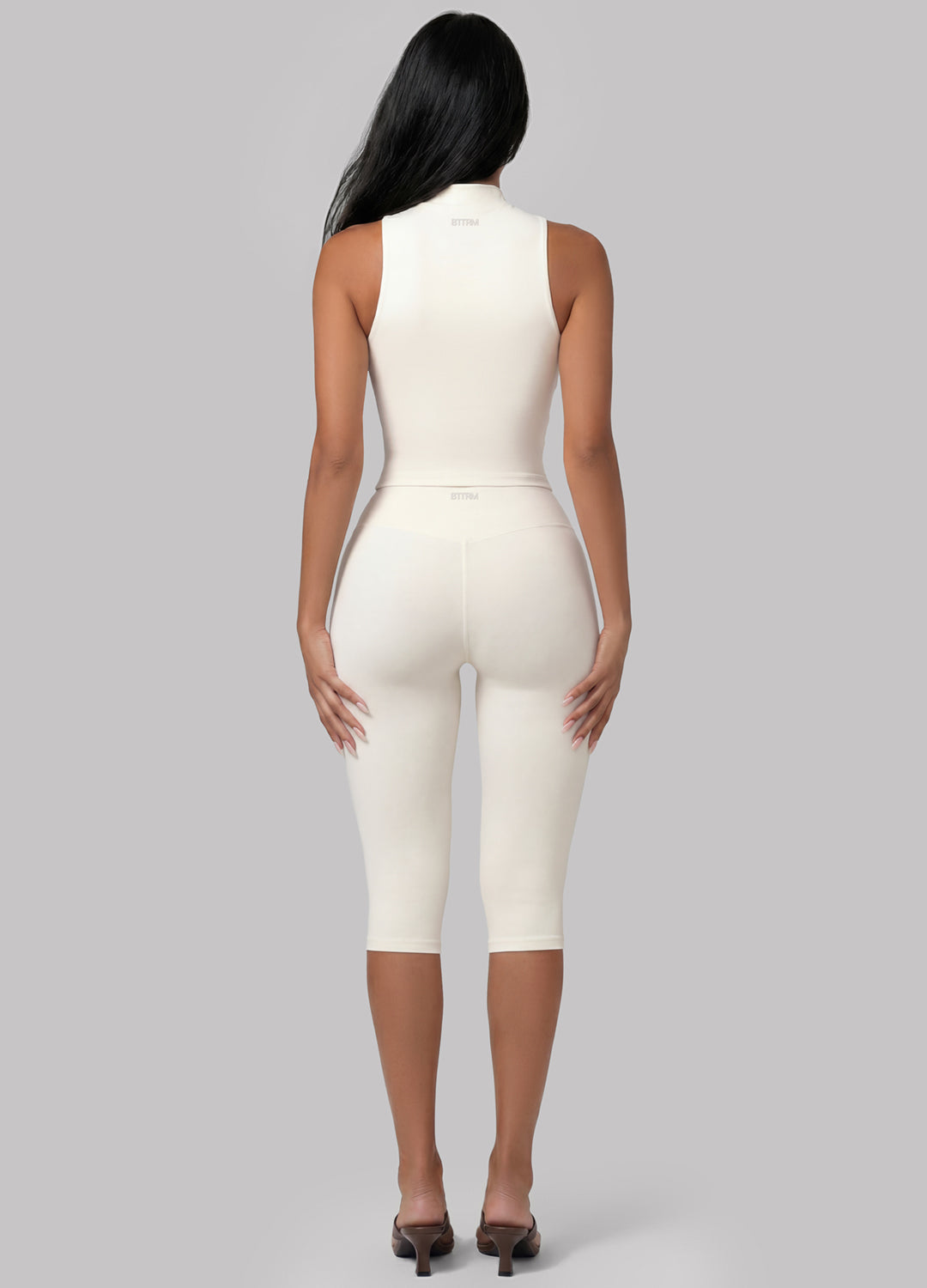 Pilates & studio-ready ivory sculpt capri leggings with a high-waist design for comfort and support.