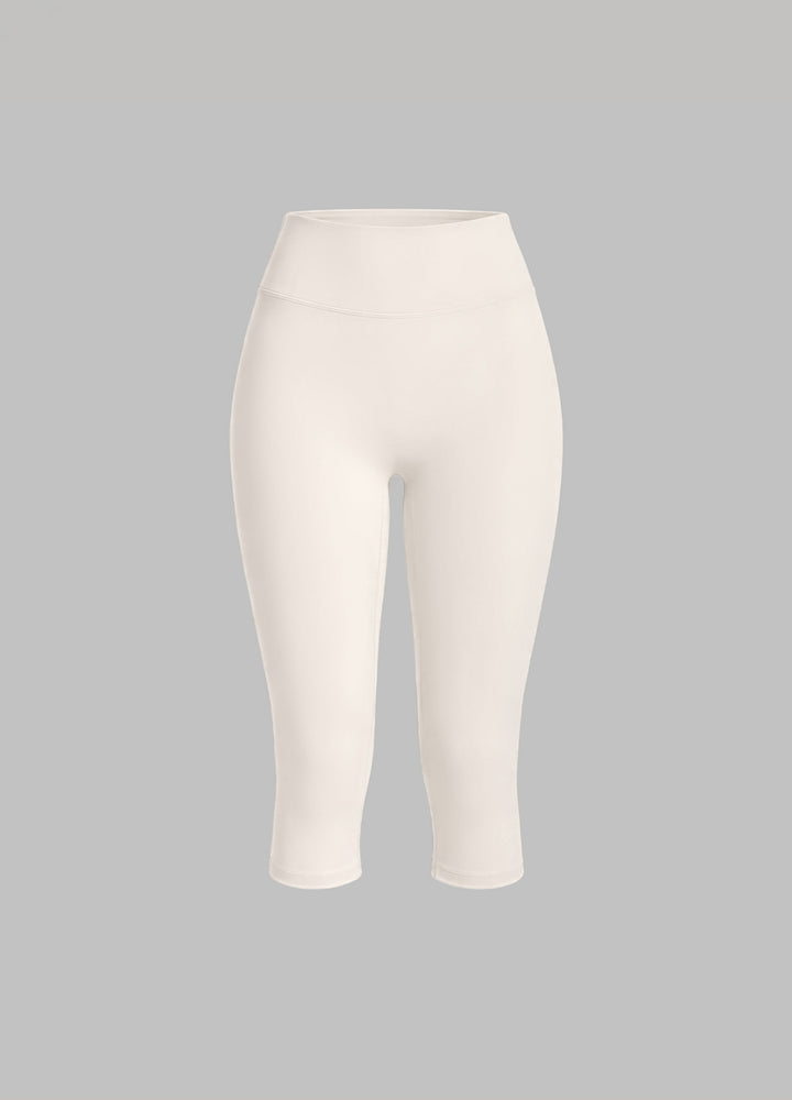 Sculpting ivory capri leggings for women, designed for activewear, pilates, and studio performance.