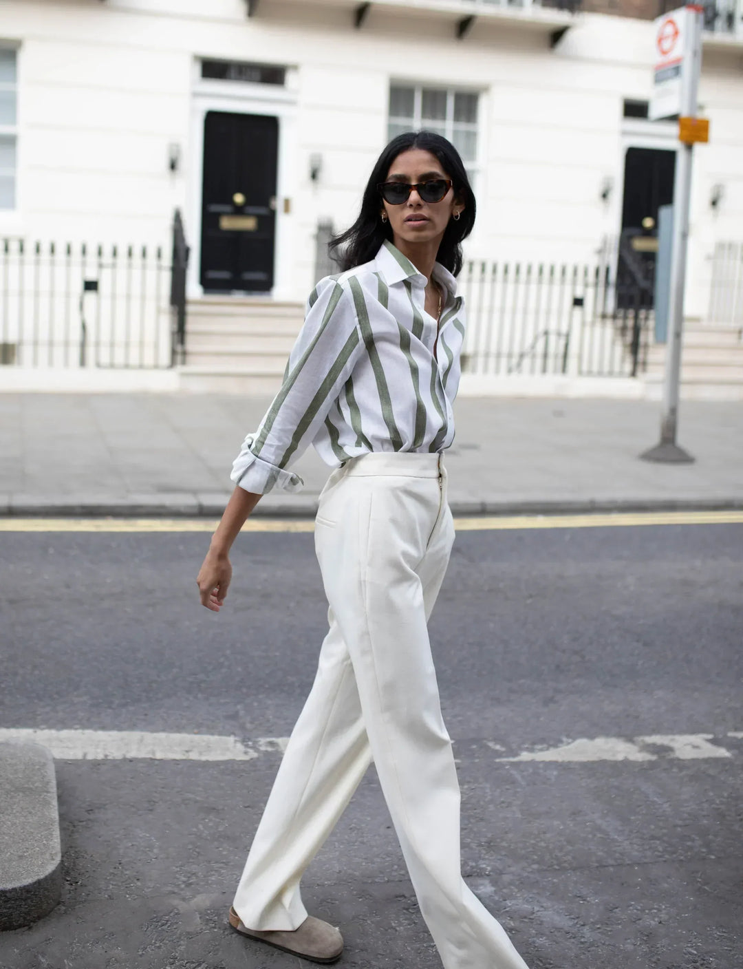 Women's khaki striped button-up shirt in a relaxed fit, perfect for casual everyday wear.
