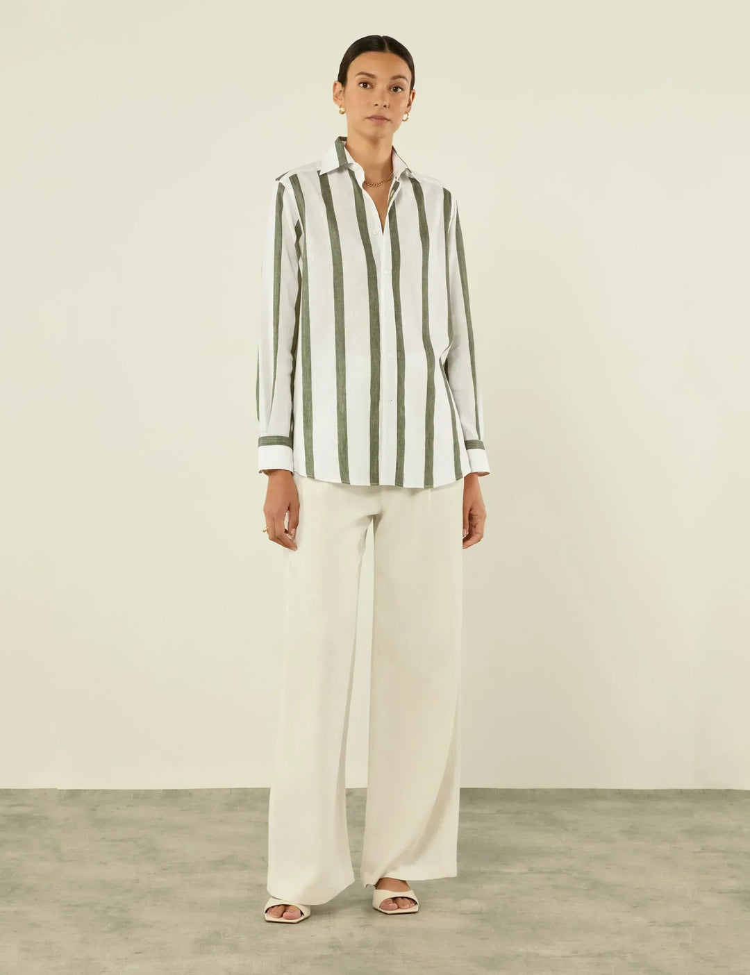 Khaki striped button-up top for women, featuring a relaxed fit and long sleeves for casual comfort.