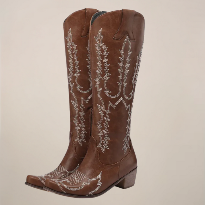Stylish women's knee-high western boots. Classic cowboy design, pull-on fit, and comfortable block heel.