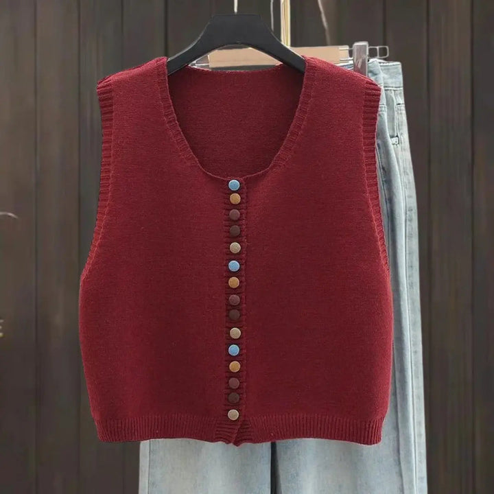Women's knit sleeveless vest cardigan with button front, perfect for layering or casual wear. Versatile seasonless style.