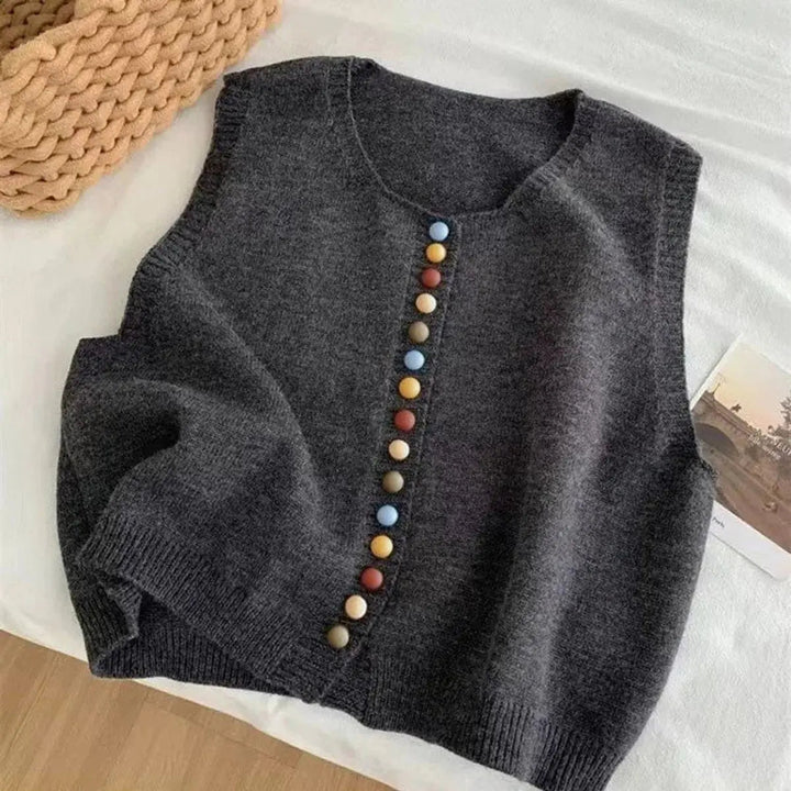 Elegant women's sleeveless knit vest cardigan with a classic button-front. Ideal versatile layering top for women's fashion.