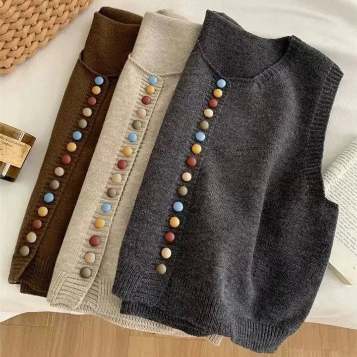 Women's sleeveless knit button-front cardigan vest. Features a round neck and is a perfect layering top for casual style.