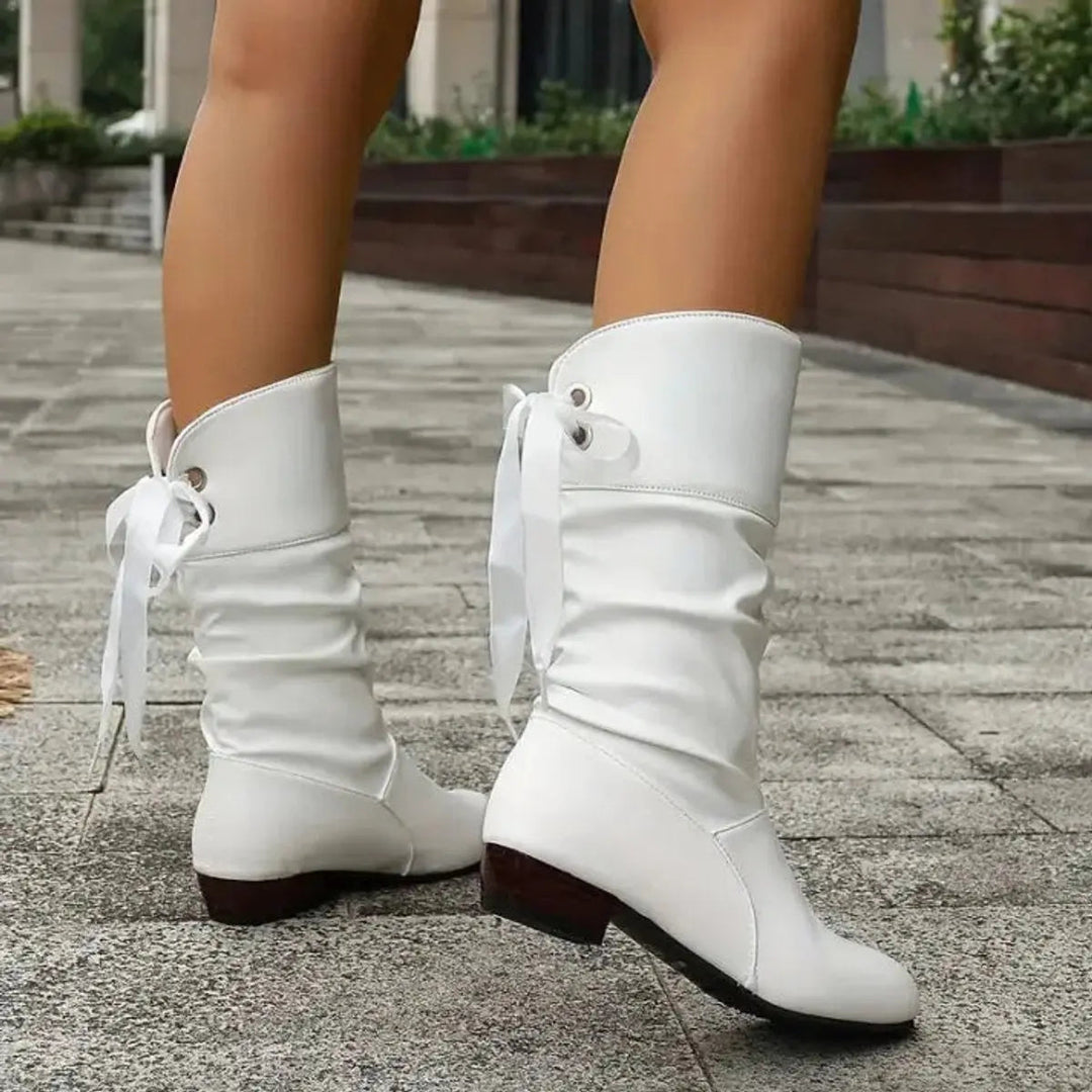 Softly ruched women's mid-calf boots, featuring a lace-up front and a practical block heel for chic style.