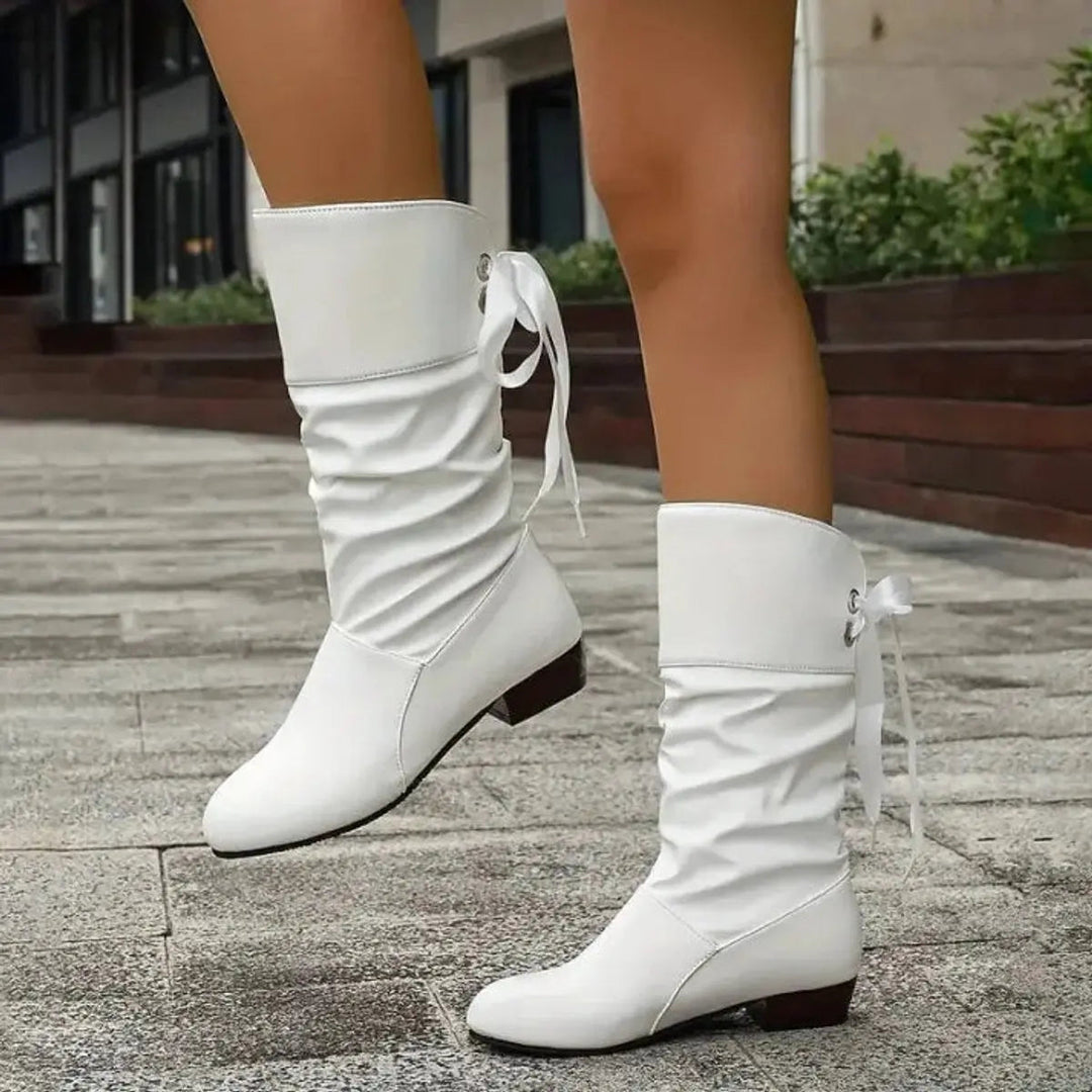 Versatile women's ruched mid-calf boots with lace-up detail & block heel, perfect for various stylish outfits.