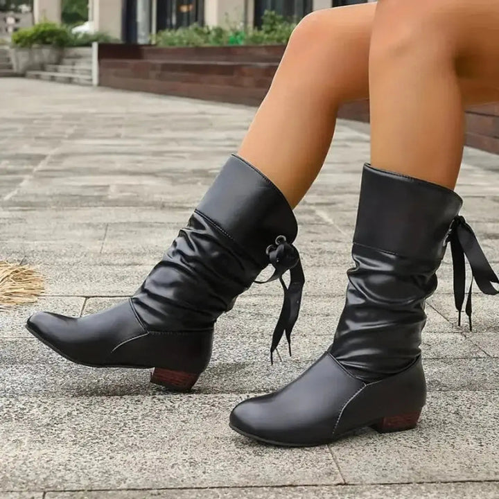 Slouchy women's lace-up ruched mid-calf boots, offering a chic, relaxed fit & comfortable block heel.