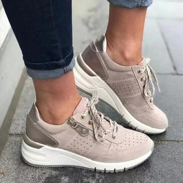 Women's lace-up wedge platform walking sneakers, featuring side zip & perforated accents.