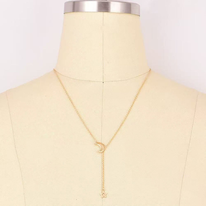 Elegant sterling silver layered necklace for women, featuring intricate celestial star & moon pendants, fashion jewelry.