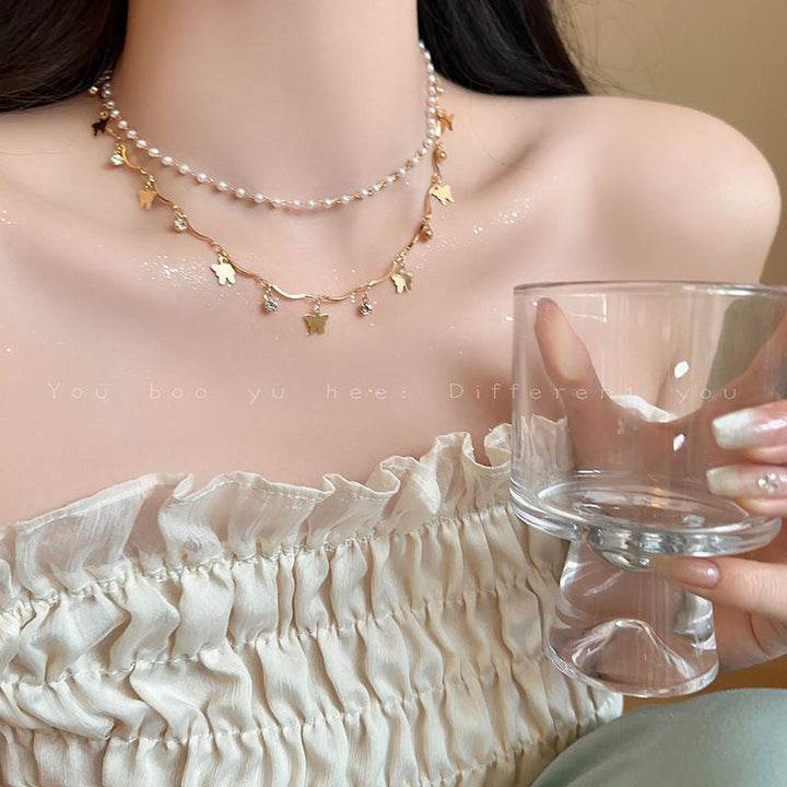 Whimsical layered pearl charm bracelet for women, featuring iridescent opals, elegant and stylish.