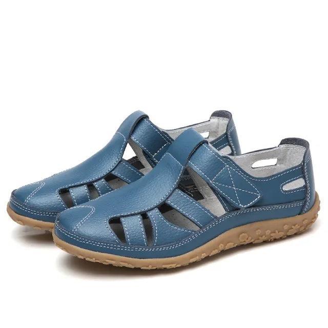Women's leather sandals with adjustable Velcro straps & supportive sole, perfect for summer walking.