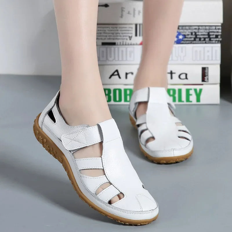 Casual women's walking sandals featuring a supportive sole & easy Velcro fastening.