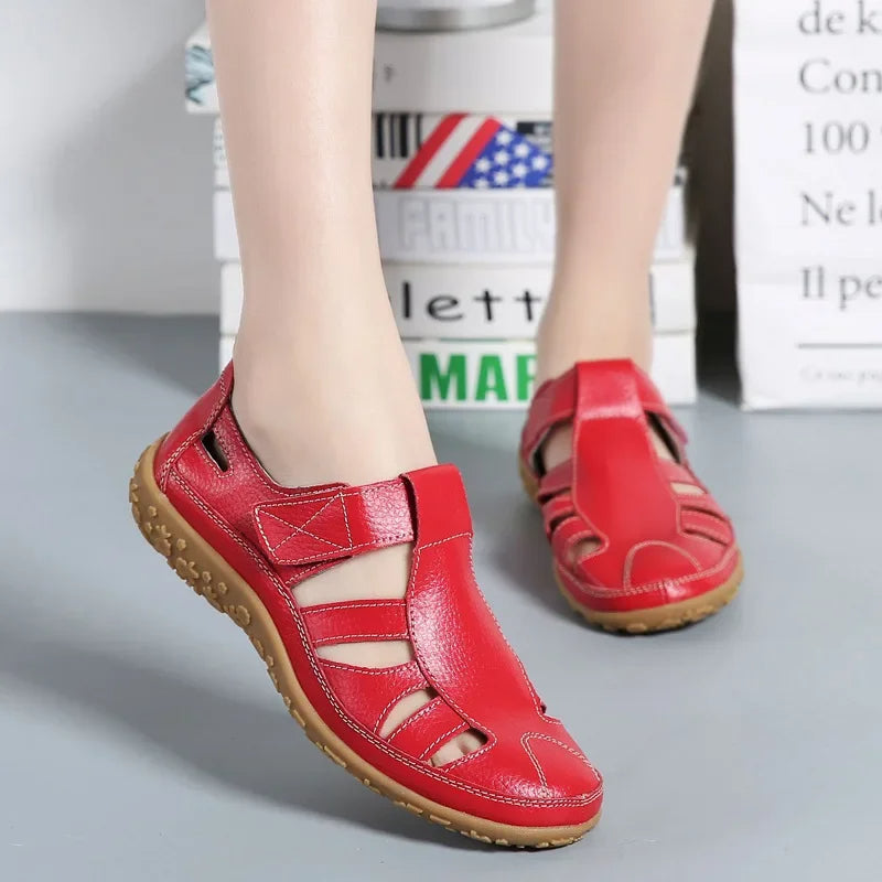 Supportive women's leather sandals with Velcro closures, ideal for summer activities.