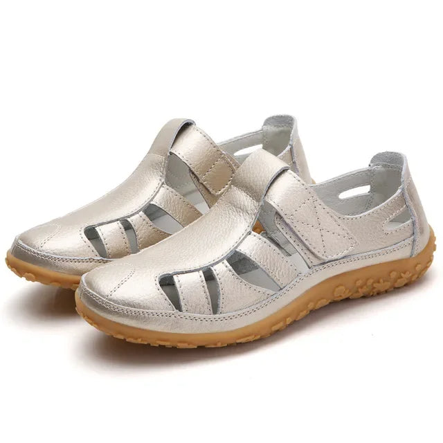 Black leather Velcro sandals for women, designed for ultimate comfort and adjustability.