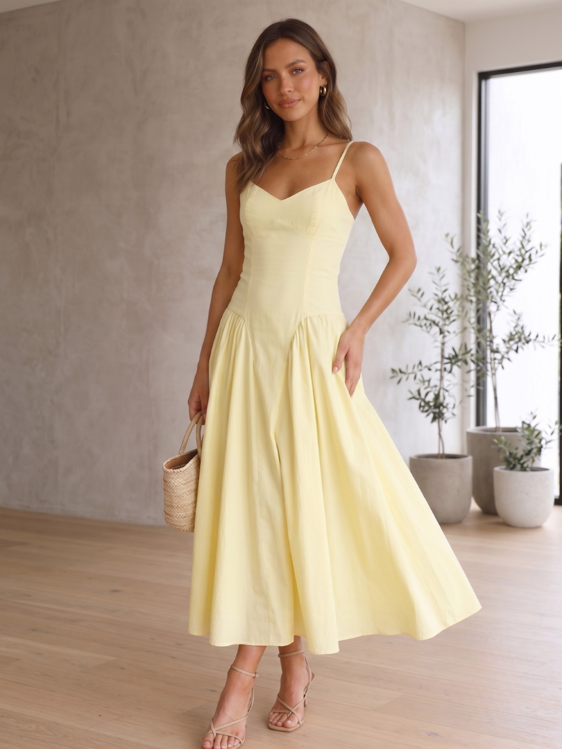 Women's lemon babydoll corset midi dress. Elegant sweetheart neckline, spaghetti straps. Perfect for summer events.