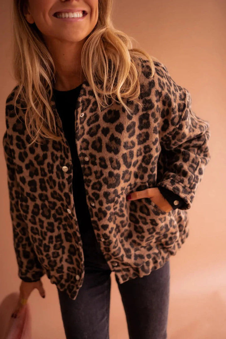 Women's leopard print bomber jacket. Stylish animal print outerwear for a trendy and fashionable casual look.
