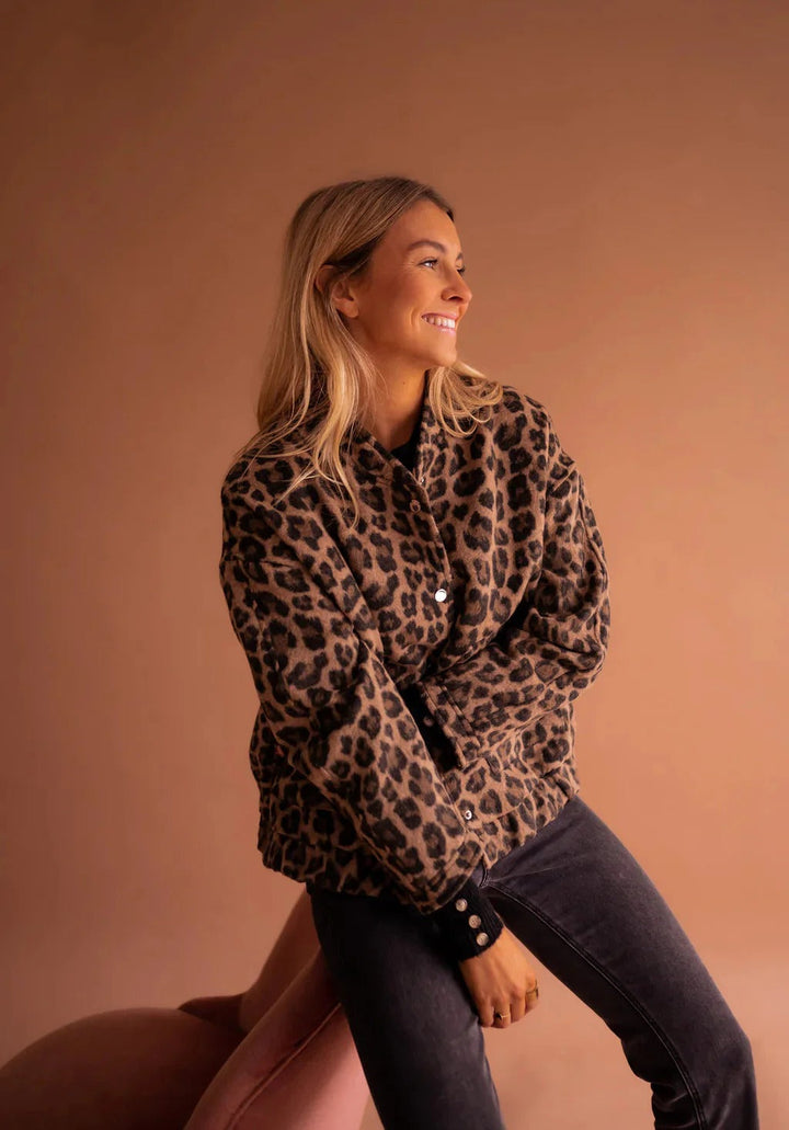 Trendy women's bomber jacket featuring a bold leopard print. Perfect casual outerwear for a stylish statement.