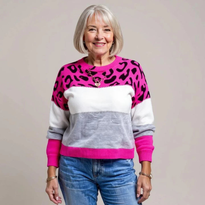 Soft women's long-sleeve leopard print pullover sweater. Trendy & cozy top for casual autumn fashion.