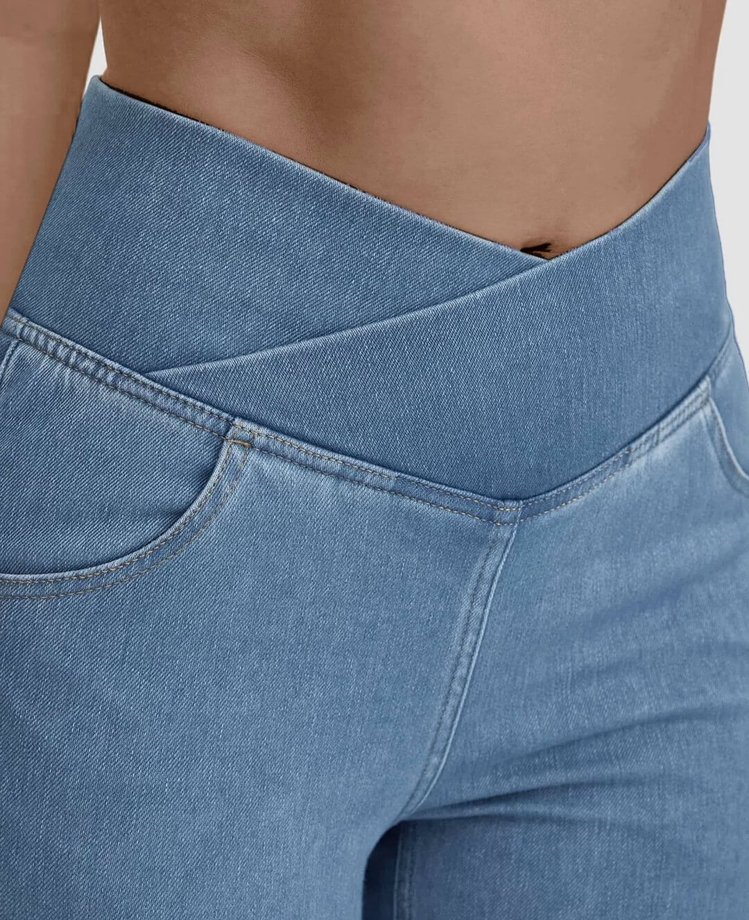Women's light blue high-waist stretch jeans, flattering fit, perfect for daily wear.