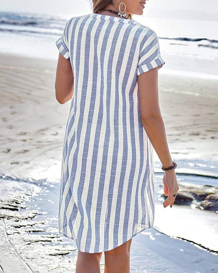 Casual women's a-line striped short sleeve button-up dress, ideal for summer beach outings or warm weather.