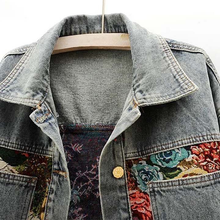 Stylish women's floral embroidered denim jacket, a fashionable casual outerwear piece for everyday wear.