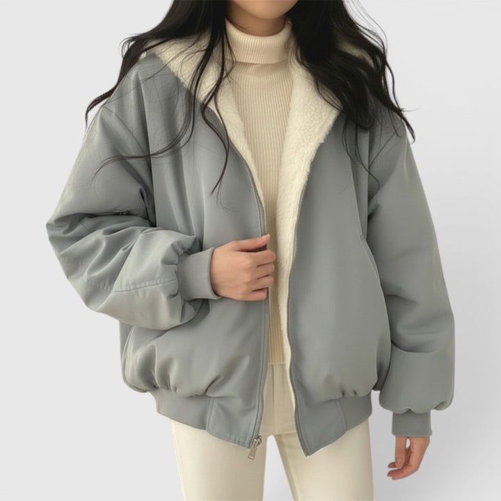 Blue women's bomber jacket, lightweight and casual, ideal for everyday fashion & comfort.