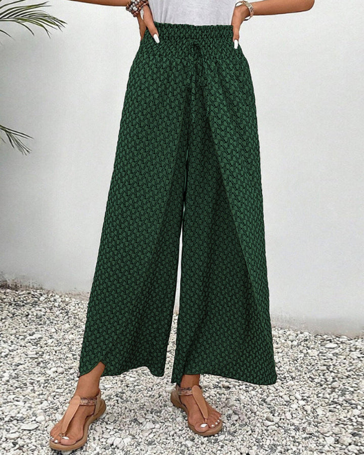 Women's lightweight abstract print flowy trousers with elastic waist, perfect for comfortable wide leg styling.