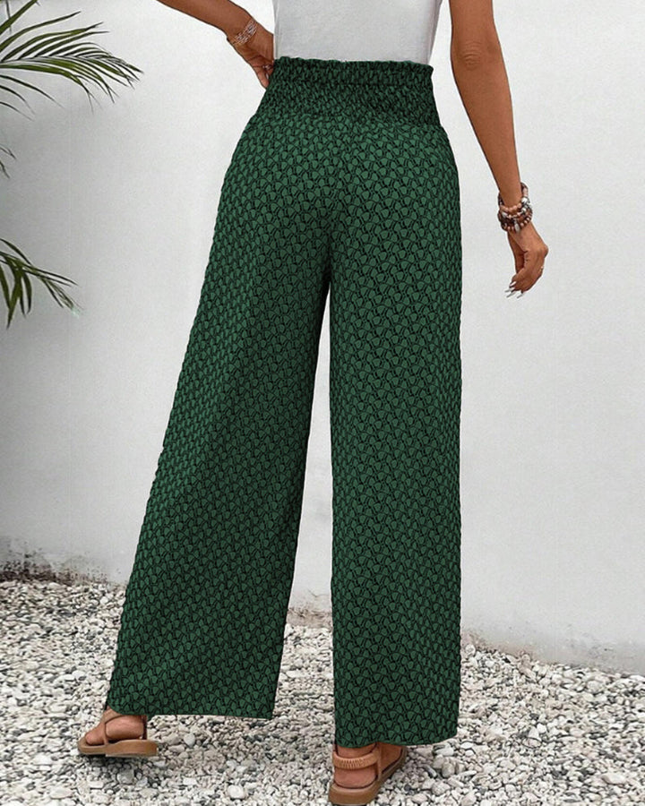 Drapey women's wide leg trousers with elastic waist, offering ultimate comfort & movement for spring/summer.