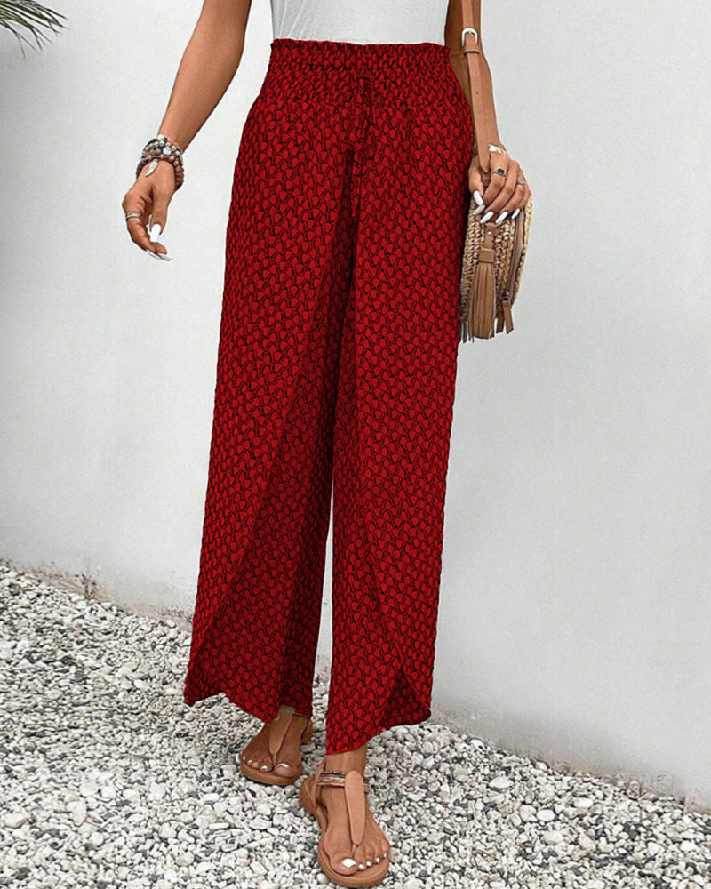 Abstract print women's flowy pants with elastic waist, designed for comfortable, stylish spring & summer wear.