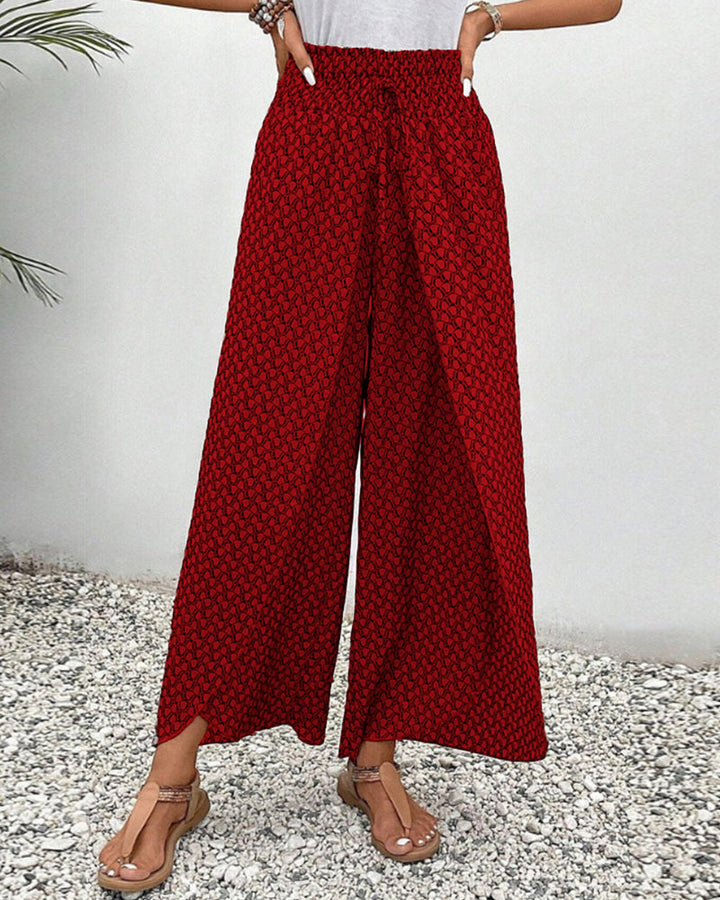 Lightweight women's trousers with a flowing silhouette & elastic waist, a must-have for chic casual outfits.