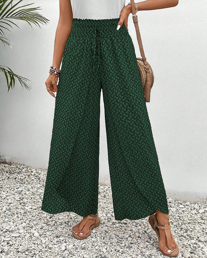 Women's comfortable wide leg trousers with an elastic waist and flowy design, perfect for casual elegance.