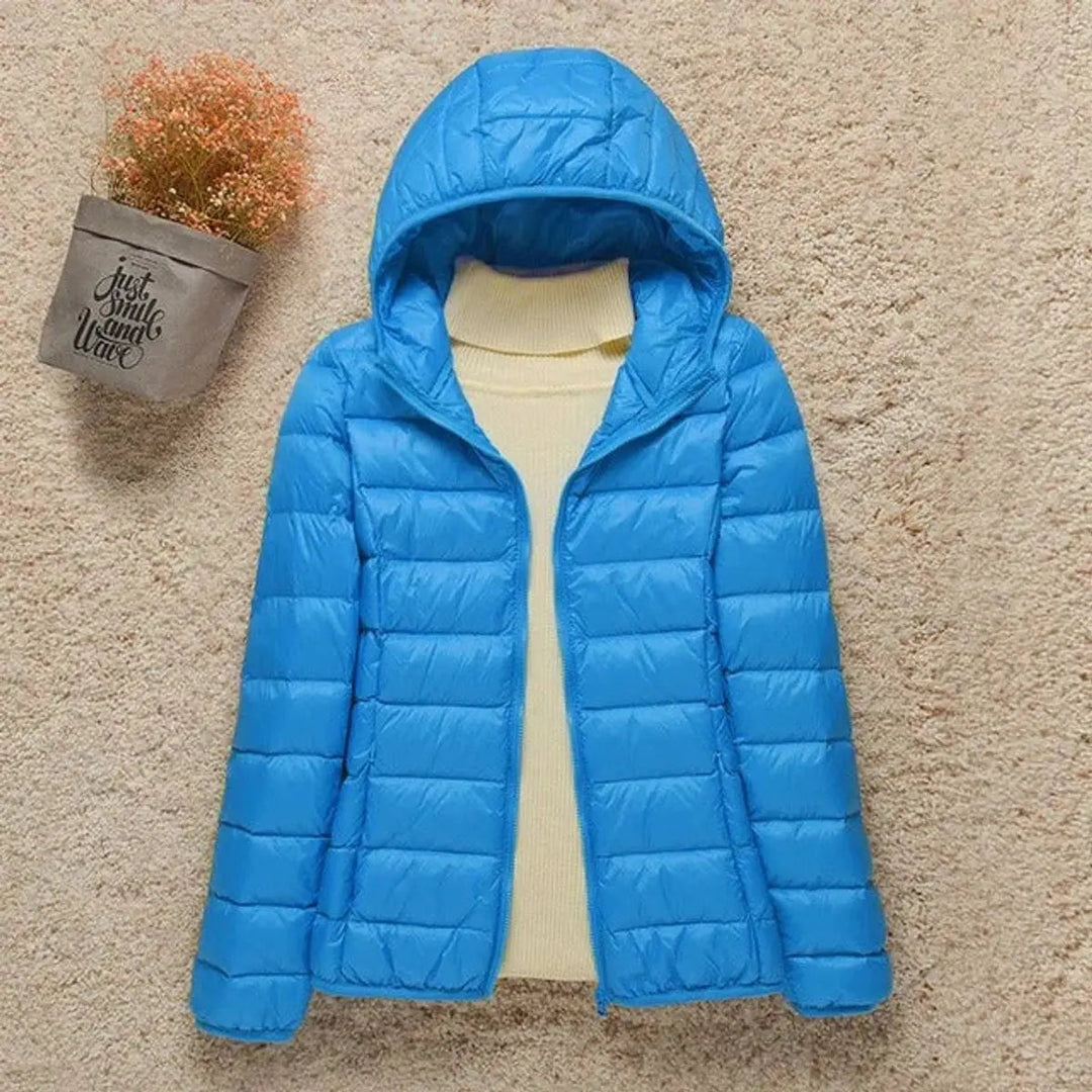 Versatile women's hooded puffer jacket. Lightweight, packable & quilted for ultimate comfort & warmth.