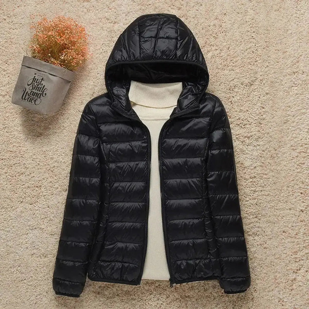Casual women's packable puffer jacket. Hooded, quilted & lightweight, great for autumn/winter outerwear.