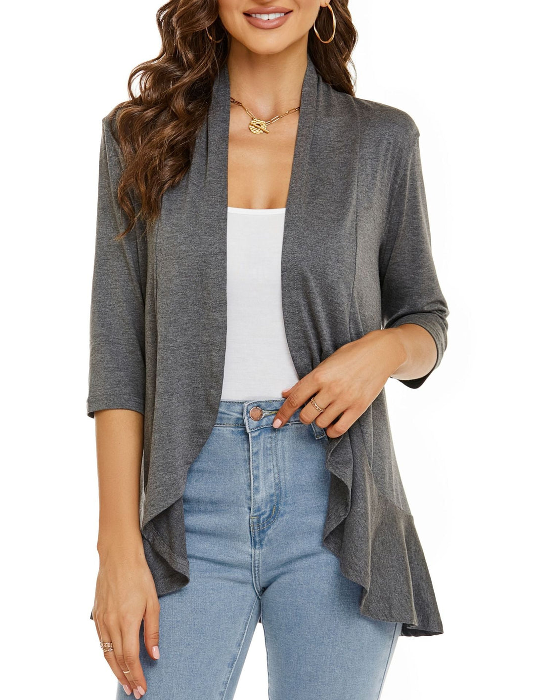 Neatly folded women's lightweight open-front cardigan, ready for casual layering and travel. Effortless style.