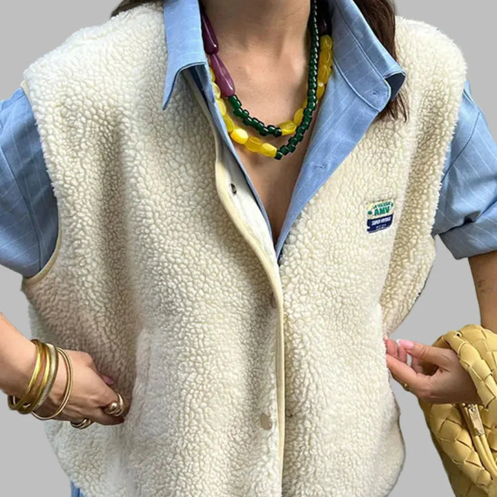 Comfortable lightweight women's polyester vest with button-up front, ideal for versatile everyday casual wear.
