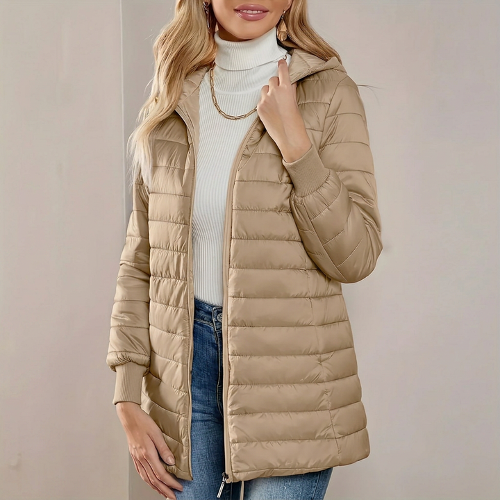 Stylish women's lightweight quilted jacket with hood, ideal for everyday wear, transitional fall and spring fashion.