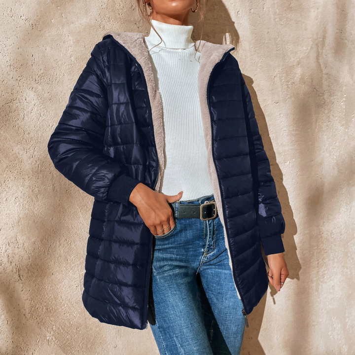 Elegant women's quilted hooded jacket, longline and lightweight, a versatile piece for spring and fall casual style.