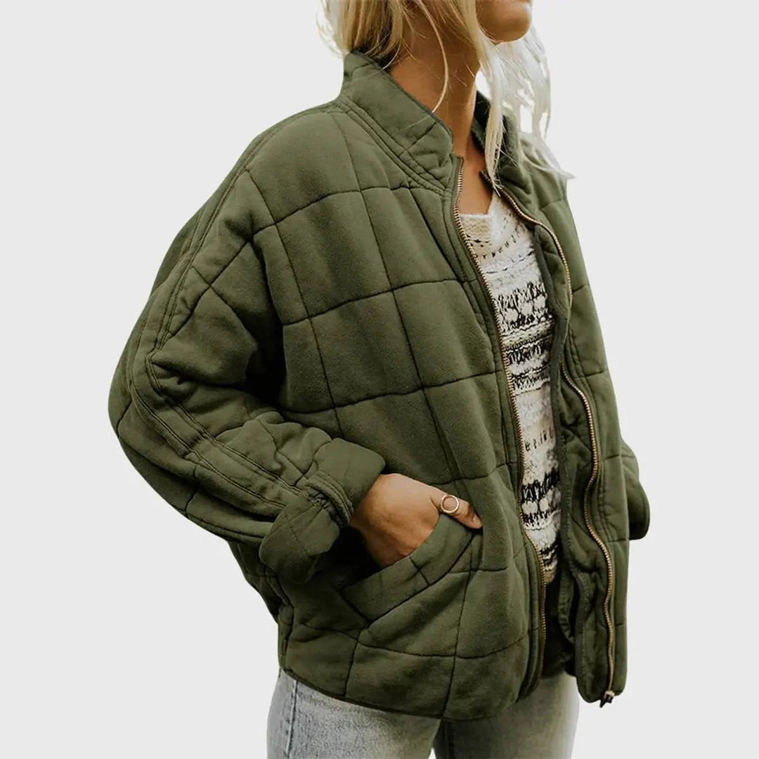 Women's lightweight quilted jacket with zip-up front & stand collar. Ideal for casual fall fashion outerwear.
