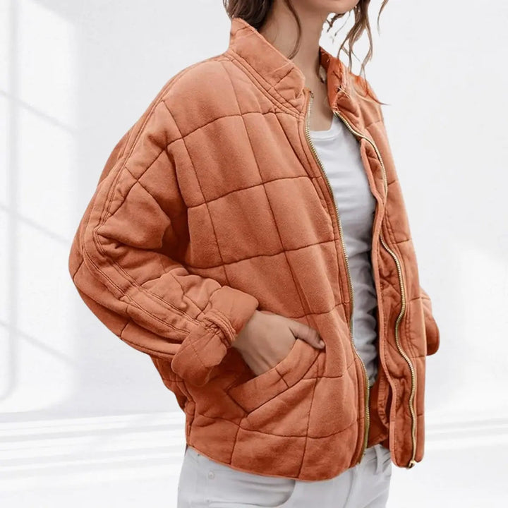 Women's casual padded jacket, quilted & lightweight. Features a zip-up front & stand collar, ideal for outdoor fall.