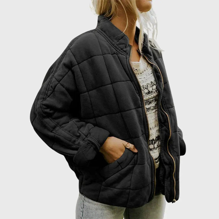 Comfortable women's quilted jacket, lightweight & padded. Zip-up front, stand collar. Perfect for everyday fall wear.