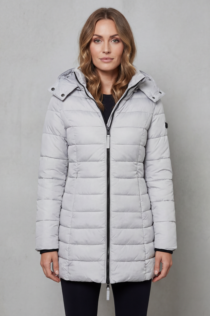 Stylish women's lightweight quilted puffer jacket, providing warmth for chilly autumn and winter days.