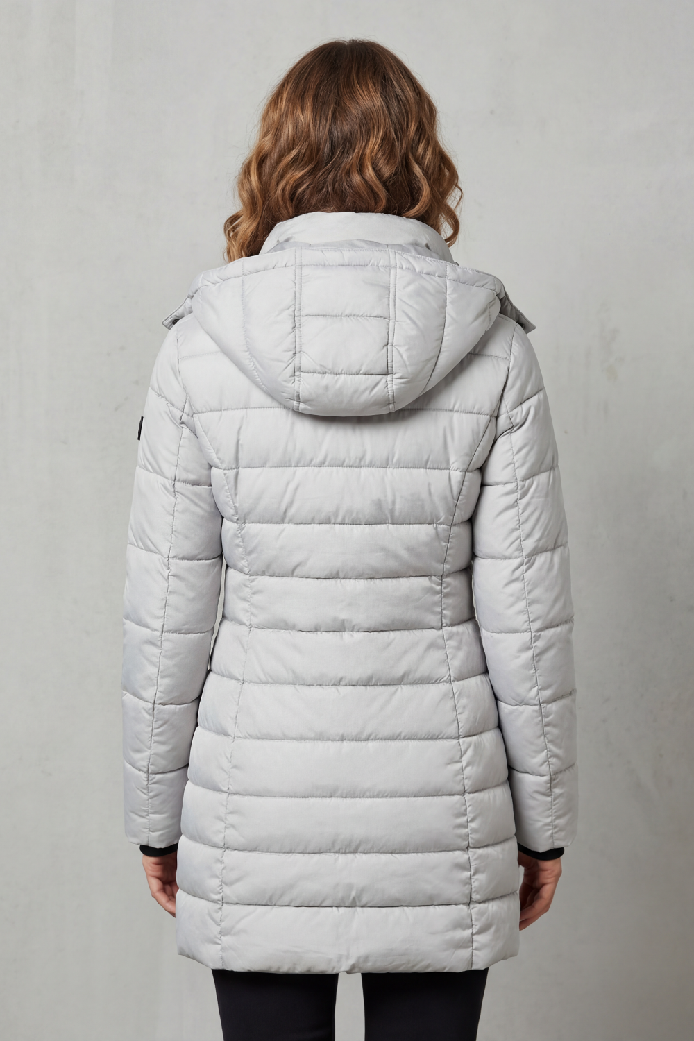 Ladies' lightweight quilted puffer coat, a stylish and warm outerwear choice for fall and winter fashion.