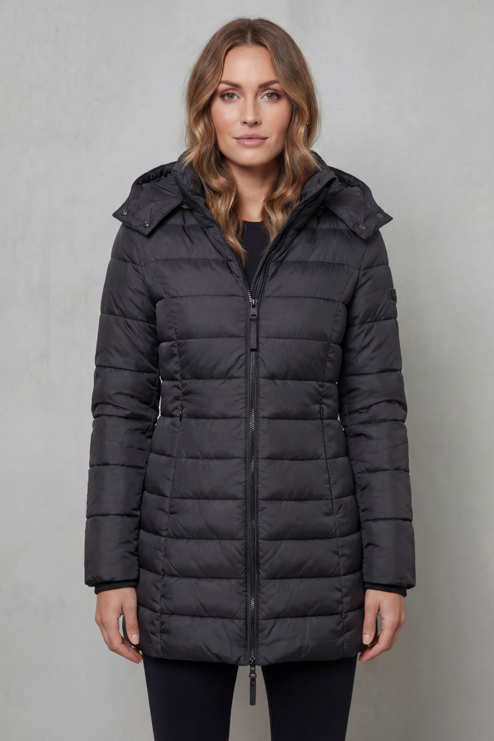 Fashionable women's lightweight puffer coat, quilted for a chic look and warm during cooler seasons.