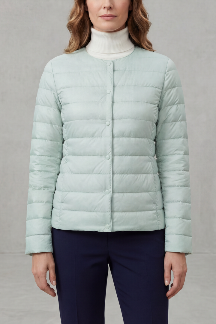Cozy women's puffer jacket with a stylish quilted texture, great for cool weather.