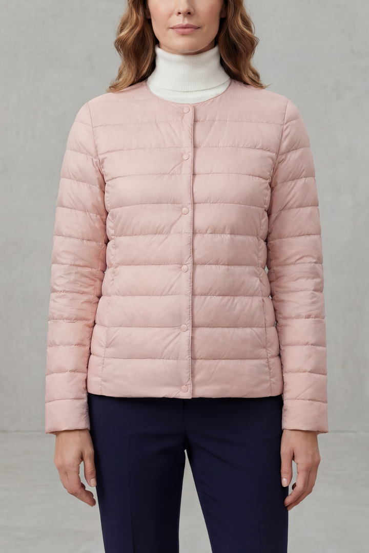 Sleek women's quilted puffer jacket, providing a flattering fit and comfortable warmth.
