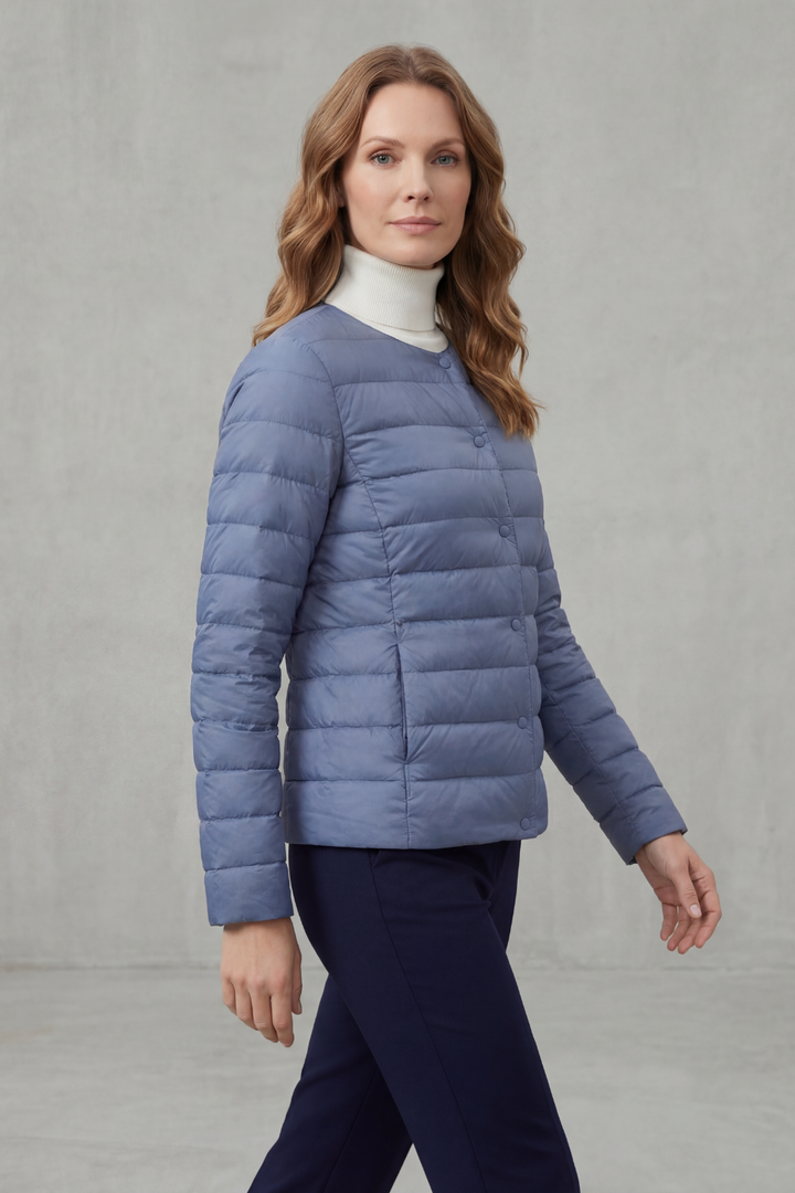 Essential lightweight puffer jacket for women, featuring a chic quilted design and cozy fit.