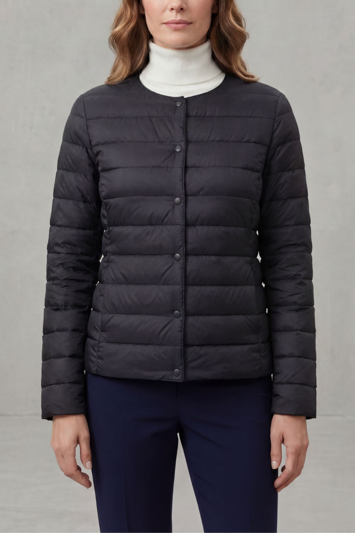 Transitional women's quilted puffer jacket, combining warmth with a sleek, modern look.