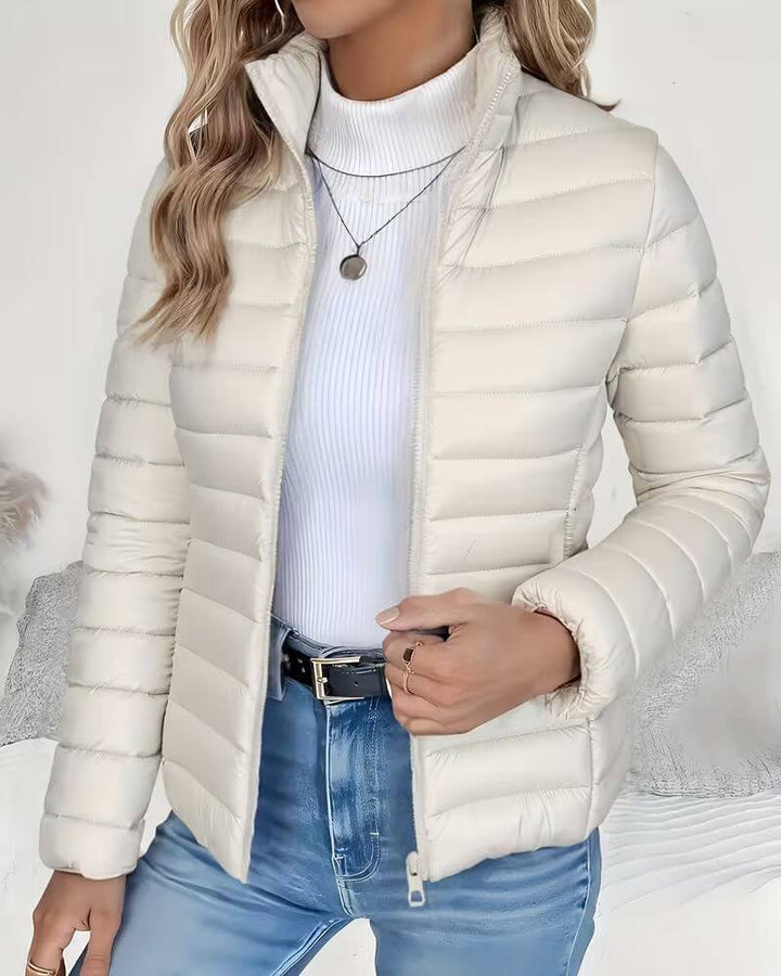 Versatile women's lightweight puffer jacket, quilted, with stand collar for everyday style.