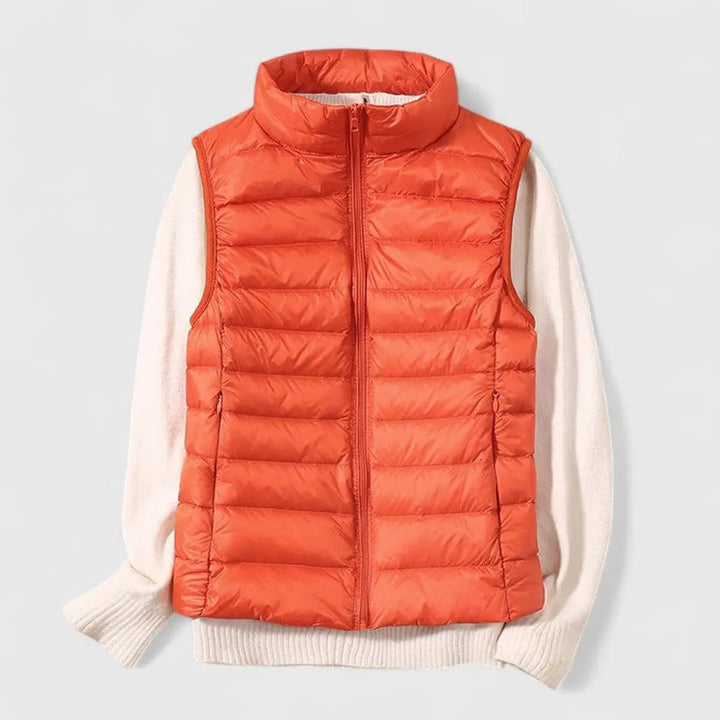 Women's lightweight quilted puffer vest. A stylish sleeveless gilet, perfect for versatile layering and autumn fashion.